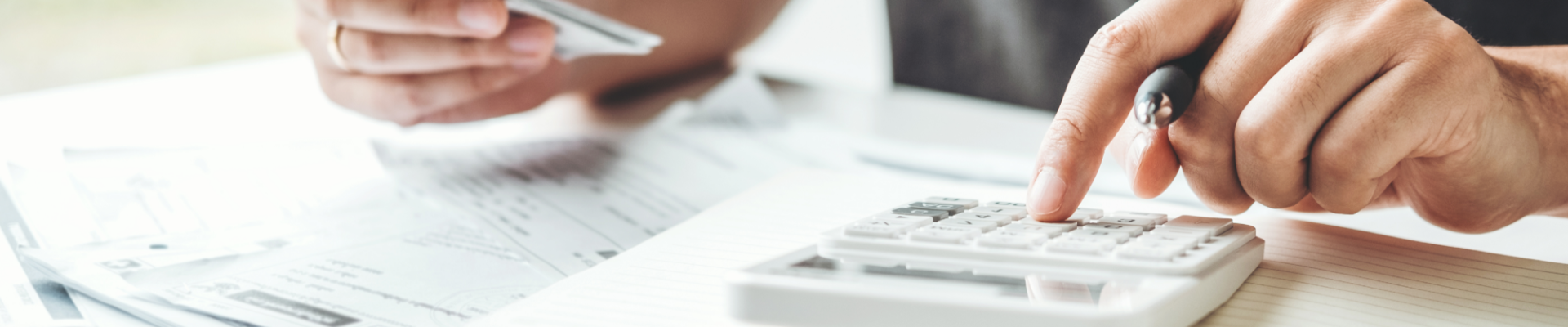 Man calculating finances, symbolizing smart budgeting and financial decision-making.